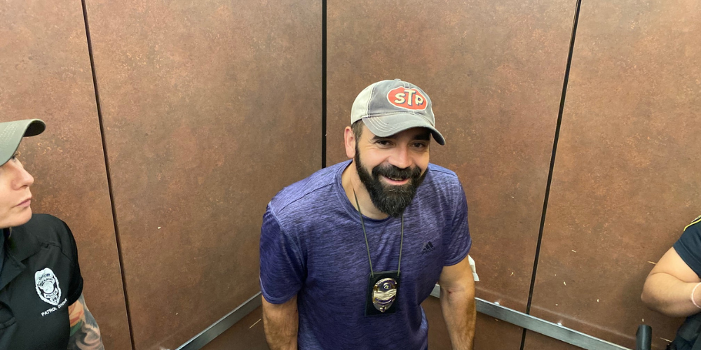 Andy with his crew at the police station